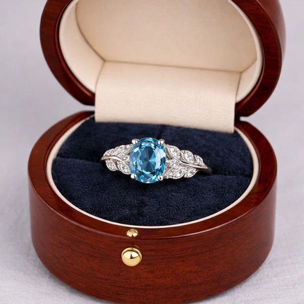 Elegant Oval Blue Topaz Silver Ring with Diamond Accents