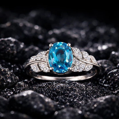 Elegant Oval Blue Topaz Silver Ring with Diamond Accents