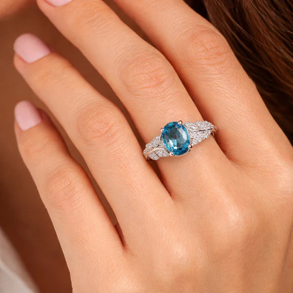 Elegant Oval Blue Topaz Silver Ring with Diamond Accents